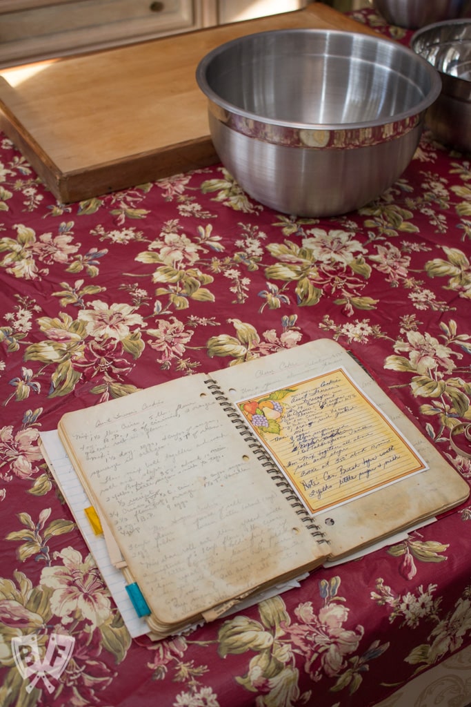 A notebook full of family recipes on a table.