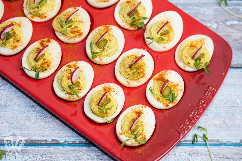 Deviled eggs in a red egg tray