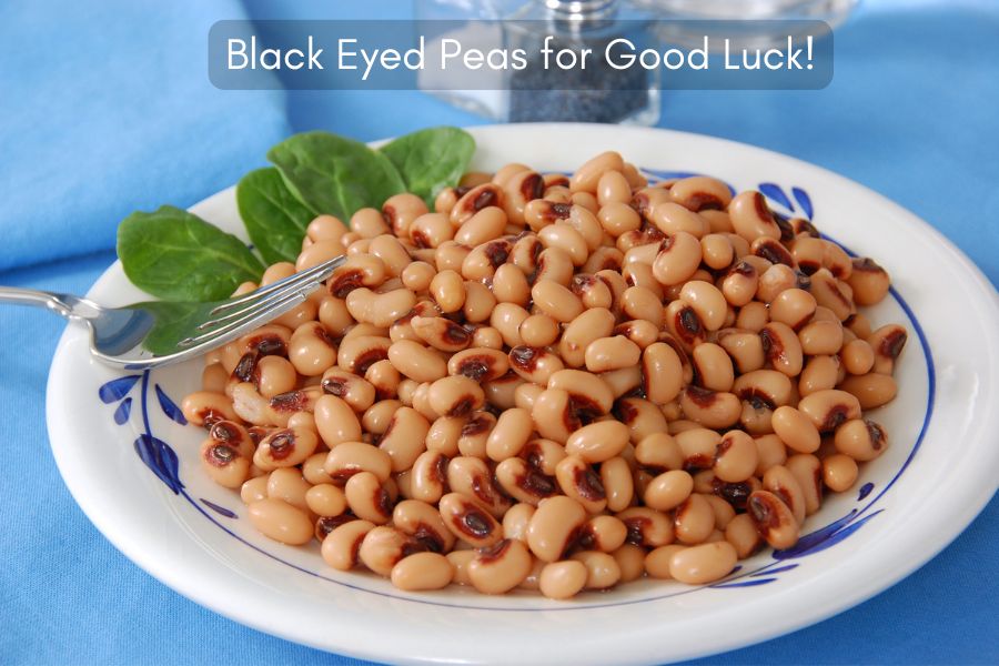 Plate of Black eyed peas on blue tablecloth